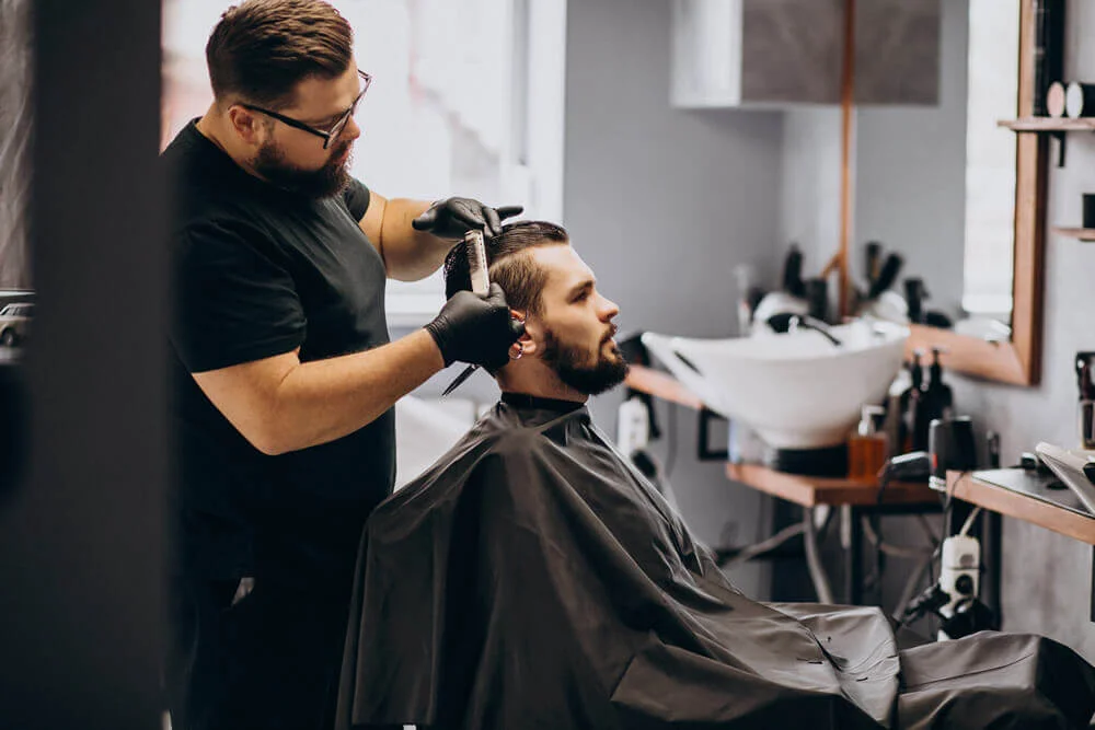 client-doing-hair-cut-hair-salon