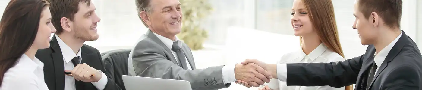 Investor & businessmen shake hands in the office